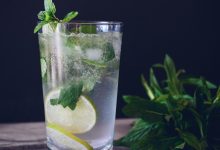 clear glass cup filled with water and lemon